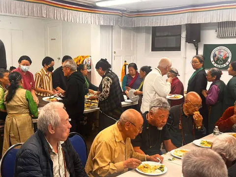 Elders sharing a communal meal
