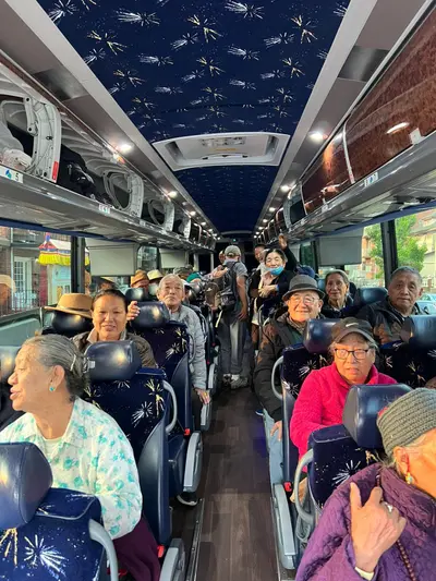 Elders on a bus for a day outing