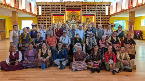 Large group photo of elders at a Buddhist temple