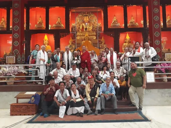 Group photo of elders at a temple in India