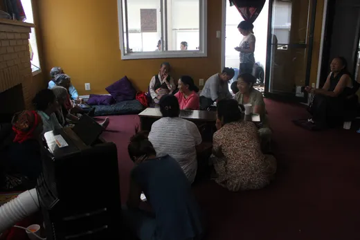 One of the earliest HEP gatherings — elders sitting together in a small room in Queens