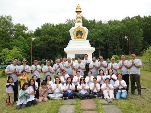 HEP volunteer group photo at a Buddhist stupa
