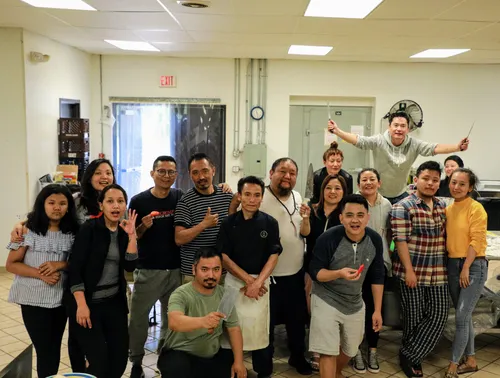 Volunteers preparing meals in the kitchen